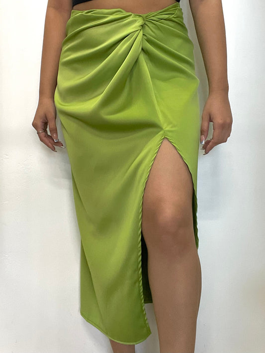 Silky green maxi skirt with a front twist and leg slit moment. 